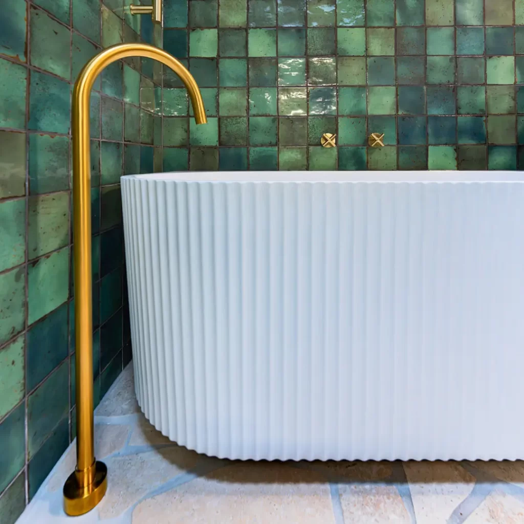 Bathtub with gold faucet